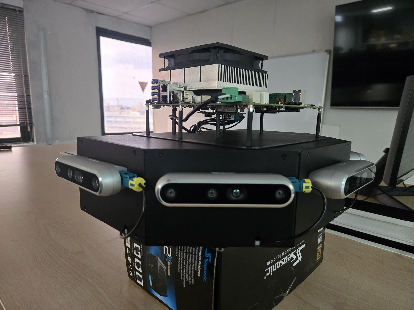 The physical rig: five RealSense D457 cameras wired to the AVerMedia D331 in an octagon-derived horseshoe, 45° apart